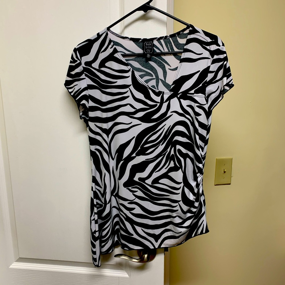 Zebra striped asymmetrical top.